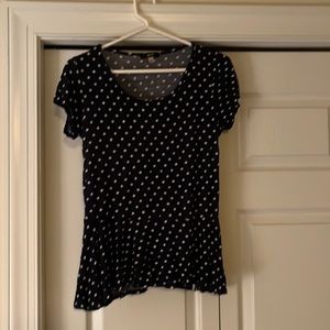 This is a small navy blue and white poke dot shirt from point